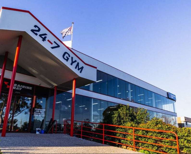 24-7 Gym building with clear blue sky